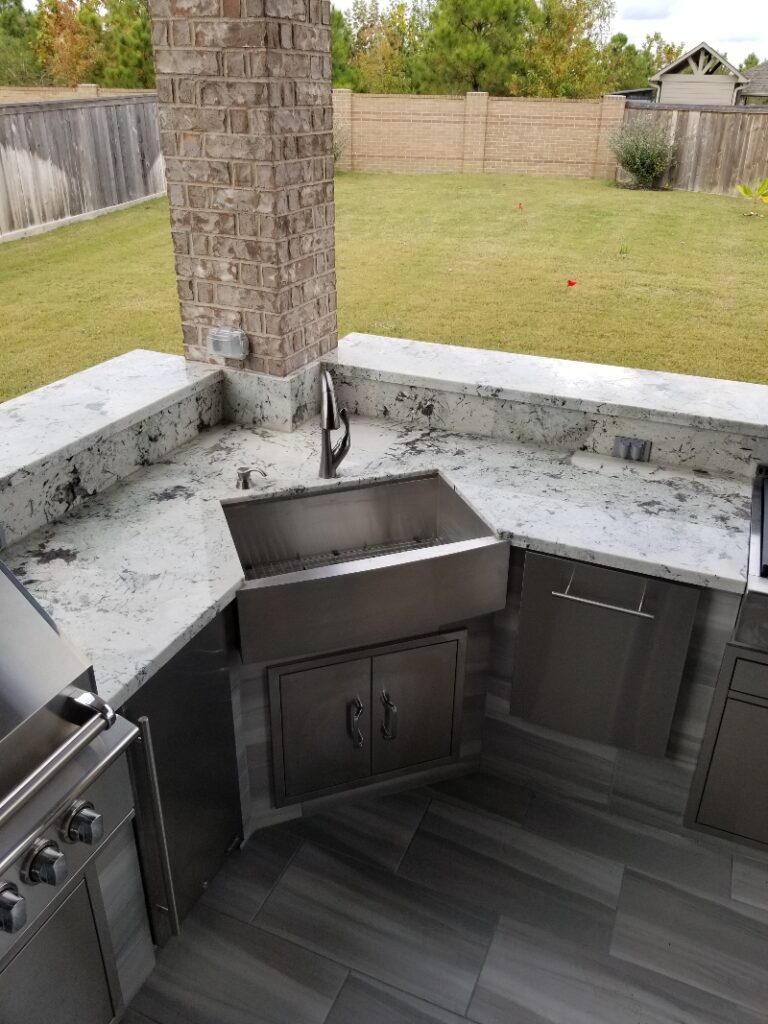 Covered patio and outdoor entertaining space built by ABF Remodeling